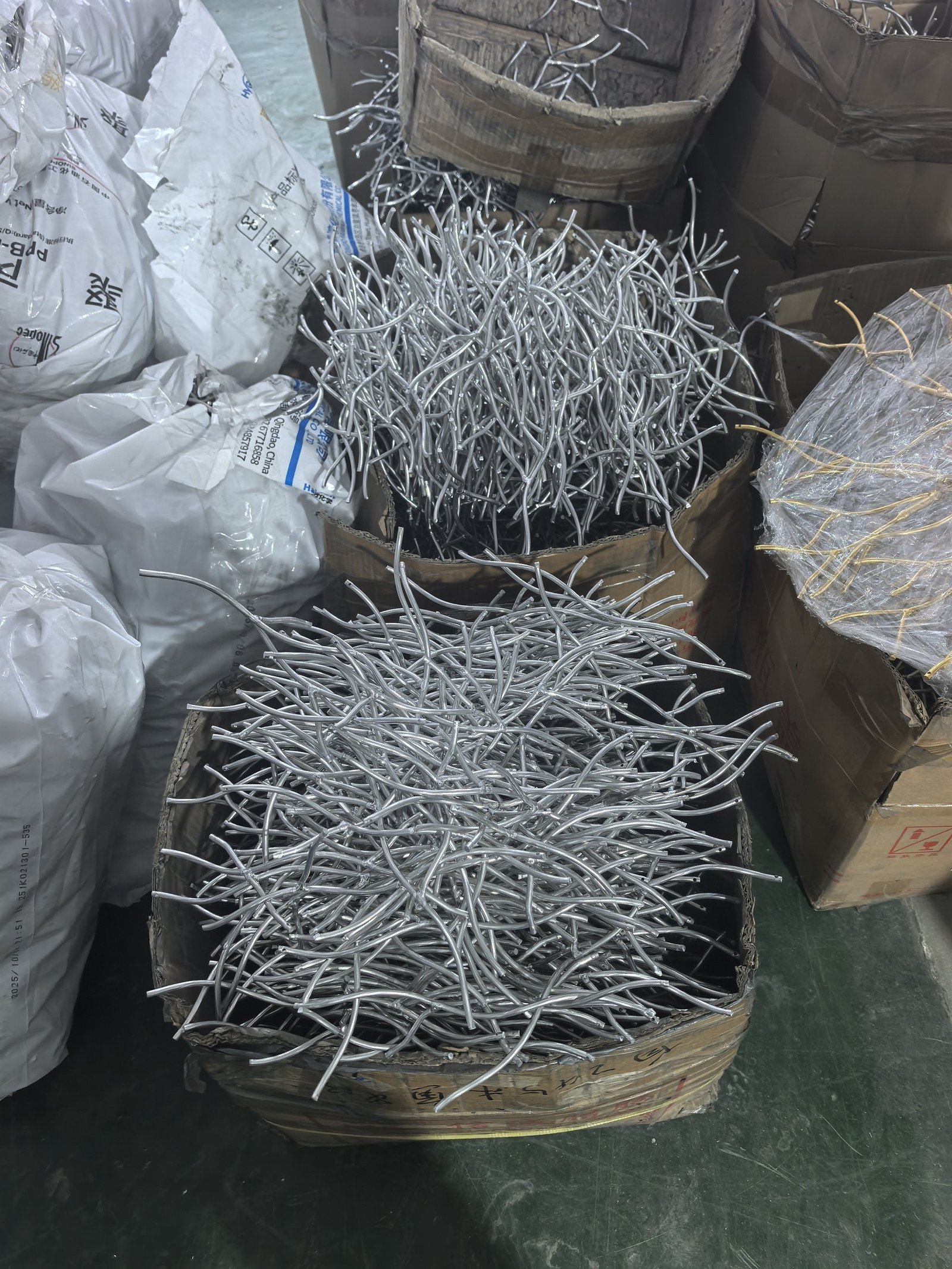 Cut aluminium sections waiting to be welded into chandelier frames
