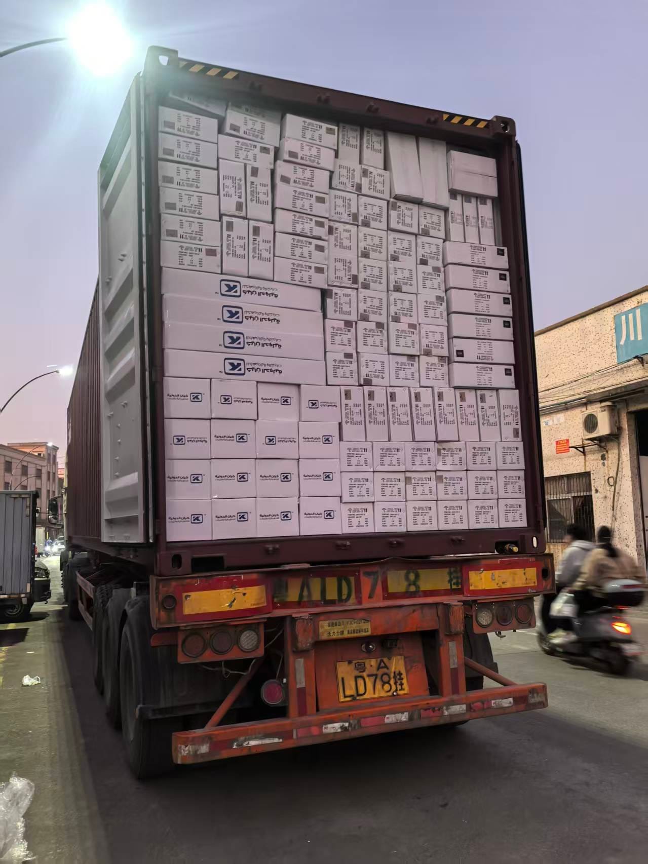 Shipping container loaded with cartons of crystal chandeliers for export from Zhongshan