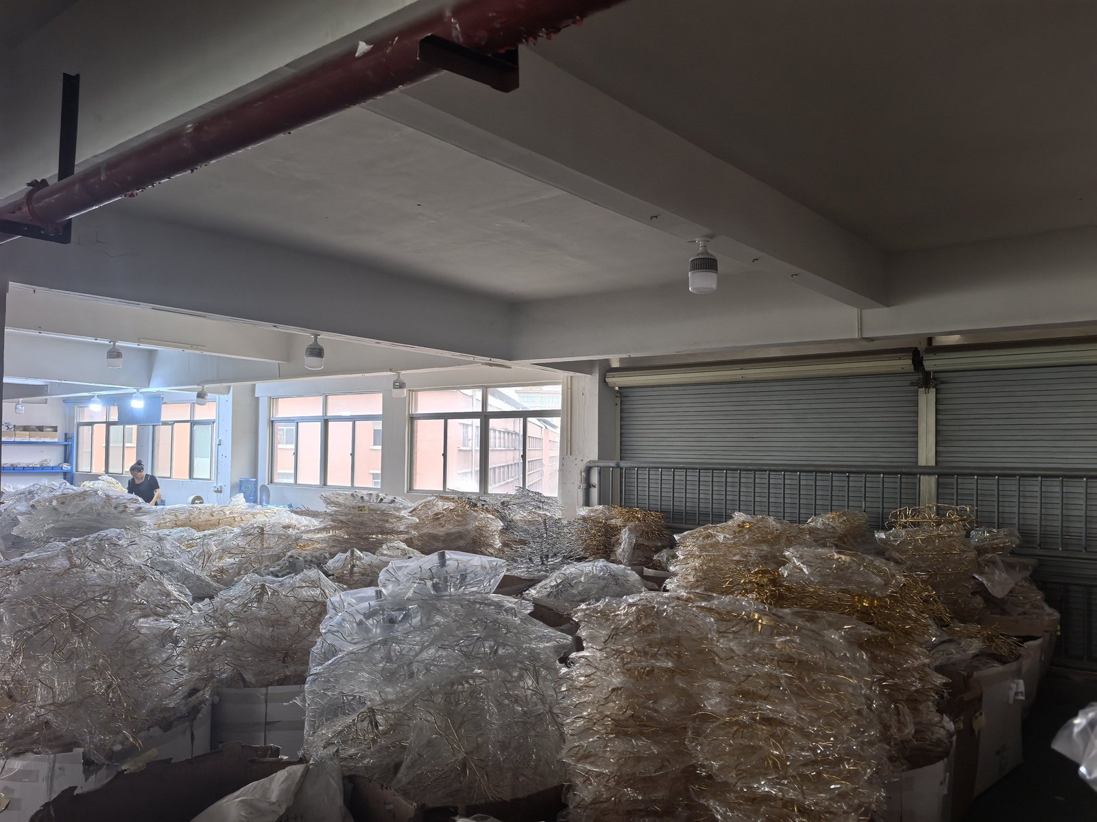 Plated chandelier frames stacked on pallets ready for crystal setting