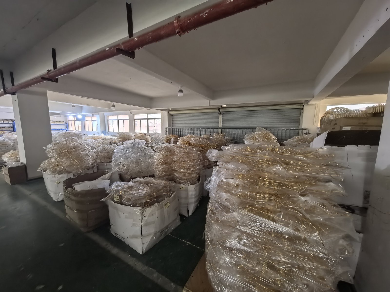 Wrapped chandelier frames held in stock between plating and assembly