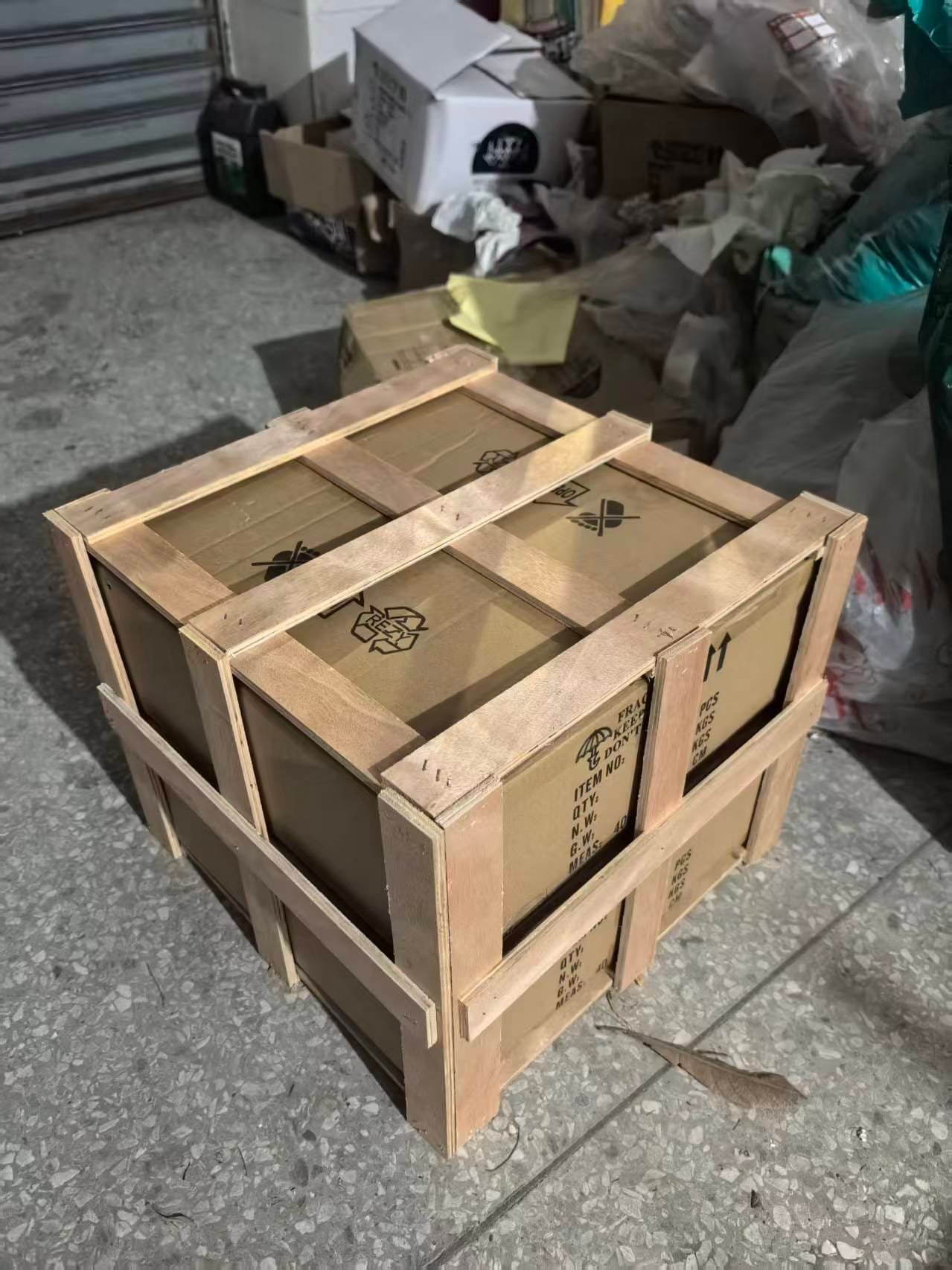 Plywood export crate with fragile and handling markings, stencilled with item number, quantity and weight