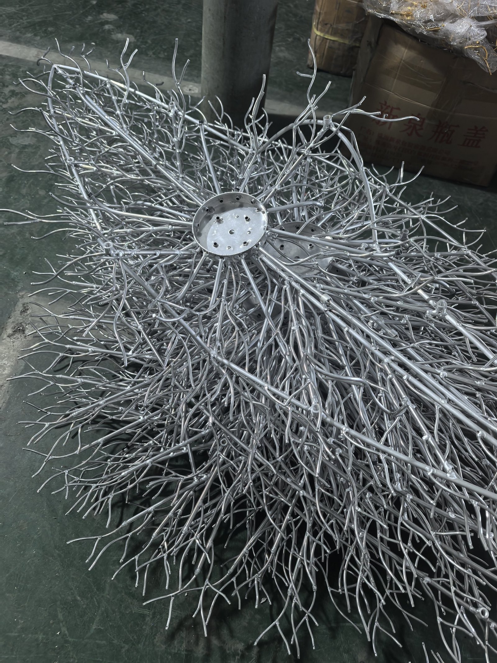 Welded aluminium branch chandelier frame before plating